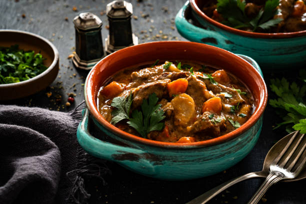 istock Beef goulash with vegetables on black table 2195029173