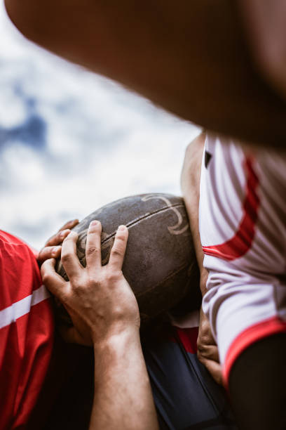 istock Close up of unrecognizable athletes during rugby match. 2195029266