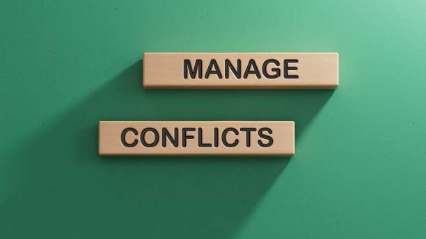 istock wooden cube with MANAGE CONFLICTS . Wooden cube blocks. Copy space.3D rendering on green background. 2195030594