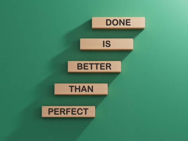istock Done is better than Perfect symbol. Wooden blocks with words Done is better than Perfect.Business and Done is better than Perfect concept.3D rendering on green background. 2195030630