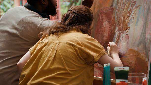 diverse artists using oil paints to create a beautiful masterpiece