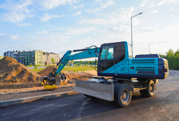 istock Excavator on road construction. Dig ground for installing borders, curbs concrete blocks. 2195035846