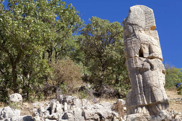 istock The second stele in Southestern Turkey. The broken stele with God Apollo 2195036713