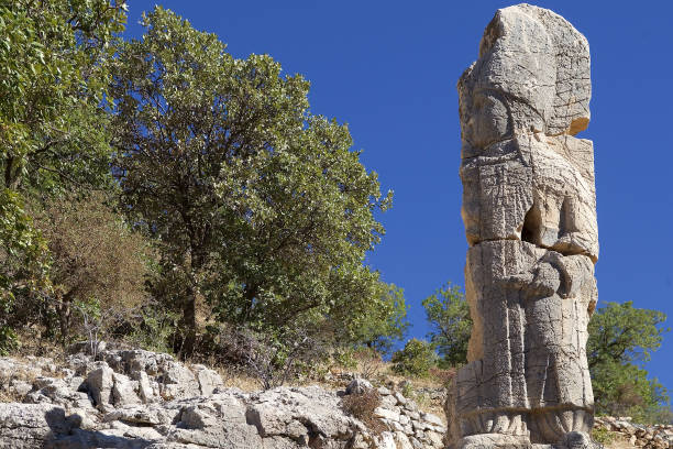istock The second stele in Southestern Turkey. The broken stele with God Apollo 2195036718