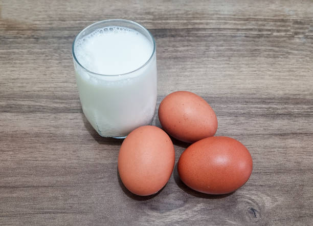 istock Chicken eggs, milk on wooden background 2195036738