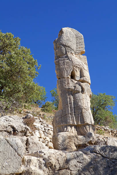 istock The second stele in Southestern Turkey. The broken stele with God Apollo 2195036739