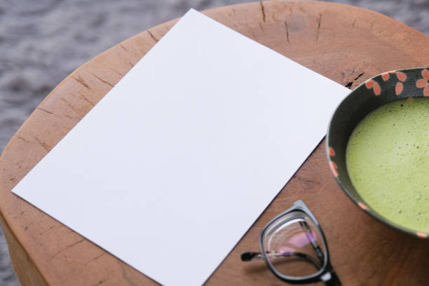 istock blank paper sheet mockup on coffee table with green matcha tea 2195039642