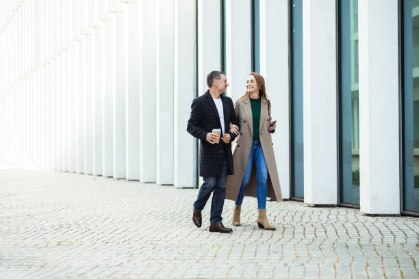 istock Couple walking and enjoying coffee 2195040056