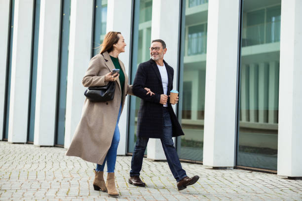 istock Man enjoying coffee and a walk with his wife 2195040057