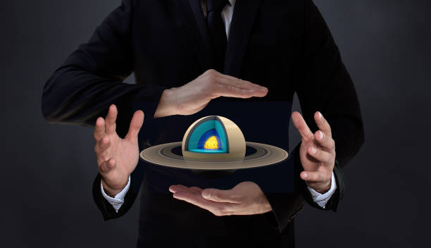 Saturn Research by New Artificial Intelligence Technology Humans who control AI-based systems will have more control over the structure and layers of the Saturn. An AI-powered scientist holding a spinning planet Saturn ring in four hands. / You can see the animation movie of this image from my iStock video portfolio. Video number: 2194760347 finger spinning globe stock pictures, royalty-free photos & images