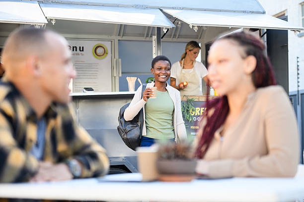 istock Young Generation Z African woman walking to table with coffee 2195040677