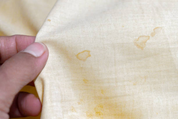 istock Dirty old pillow with yellow stains. 2195042133