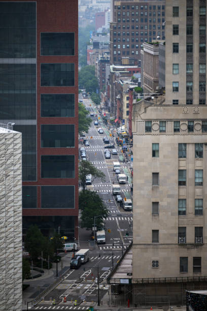 istock Street through lower Manhattan with high rise buildings 2195042362