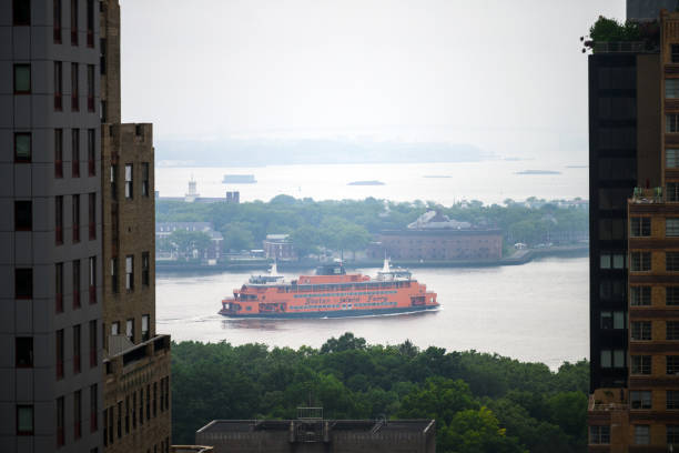 Ferry between high rise buildings downtown New York