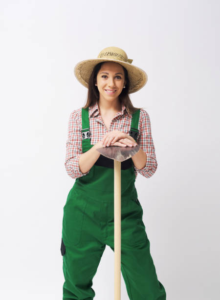 istock Female farmer posing with a hoe 2195044166