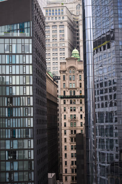 istock Old skyscraper between modern blue glass skyscrapers downtown New York 2195046063