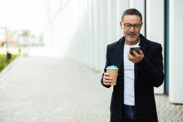 istock Businessman on a coffee break sending a voicemail 2195046985