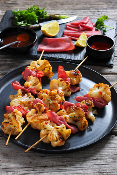 istock spicy cauliflower kebabs with corned beef on plate 2195048840