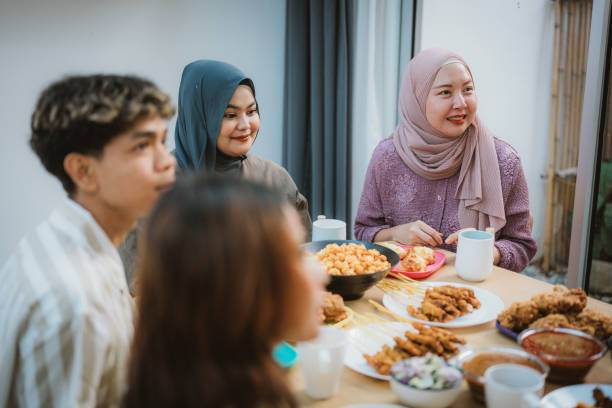 istock A Joyous Eid: Bonding Over a Festive Meal with Friends 2195051355