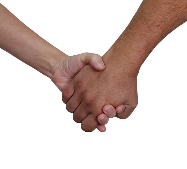 istock Two hands clasped in a firm handshake on a white background. Close-up photography. Partnership and trust concept 2195051847