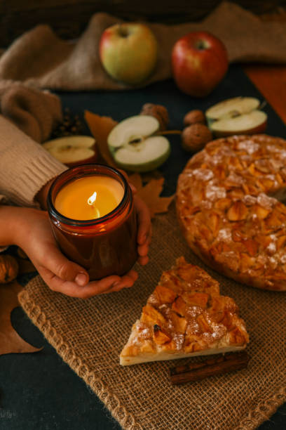 istock Candle and homemade apple pie, autumn mood 2195052305