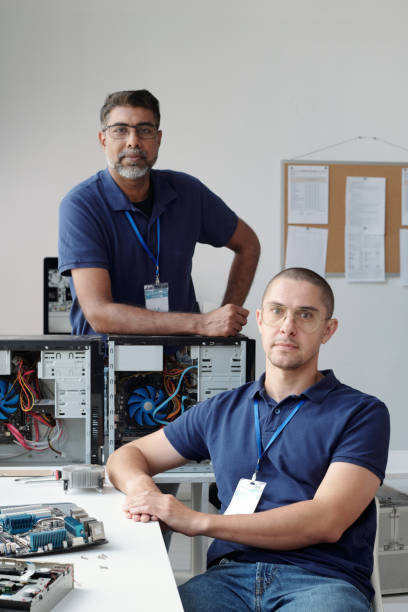 istock Portrait of IT Professionals Working on Computer Hardware 2195053139