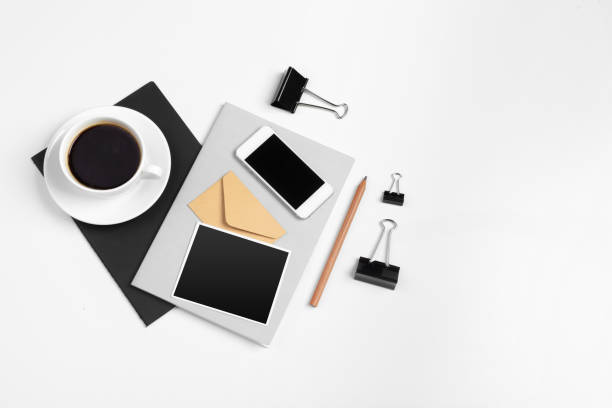 istock Smartphone and coffee cup, notepad close up top view. creative photo. 2195054680