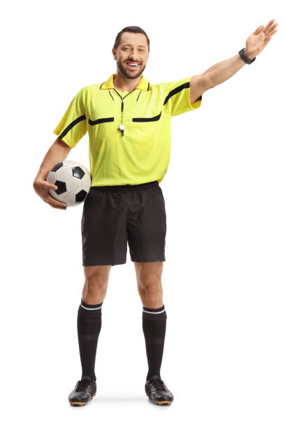 istock Football referee holding a ball and pointing with hand 2195055789