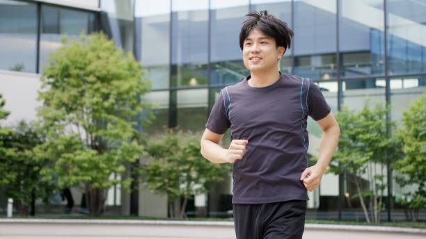 istock Man jogging in the city 2195056653