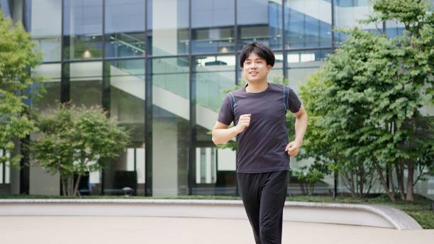 istock Man jogging in the city 2195056654