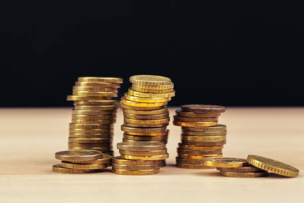 istock piles of coins on working table. creative photo. 2195060066