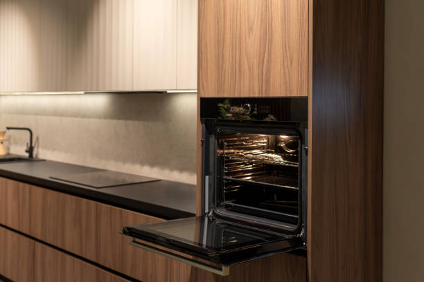 istock Spacious built-in oven with open door, ready for cooking and baking 2195062345