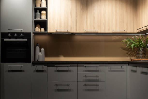 istock Built-in black electrical oven integrated into kitchen cabinet 2195062355