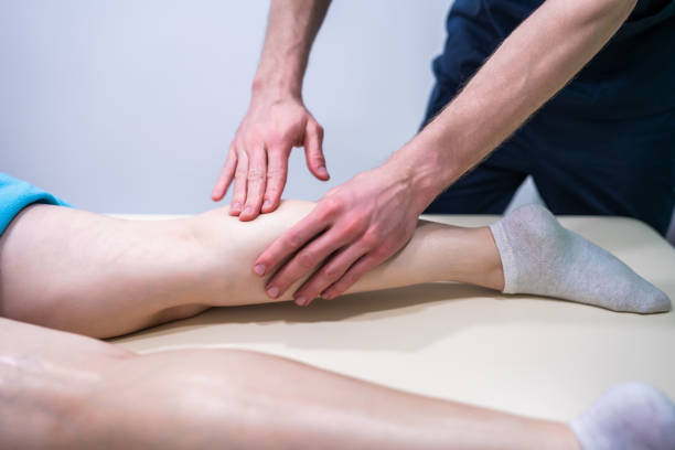 istock A woman is getting a massage on her legs. 2195064094