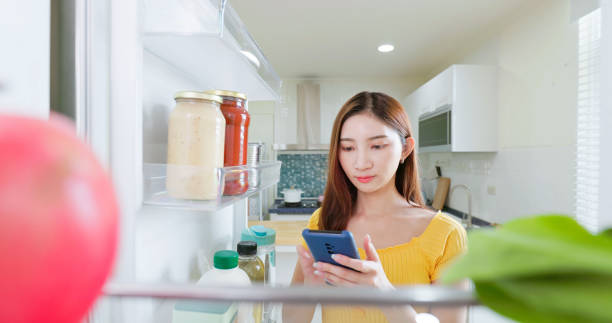 istock woman Fridge Check Order Online 2195065511