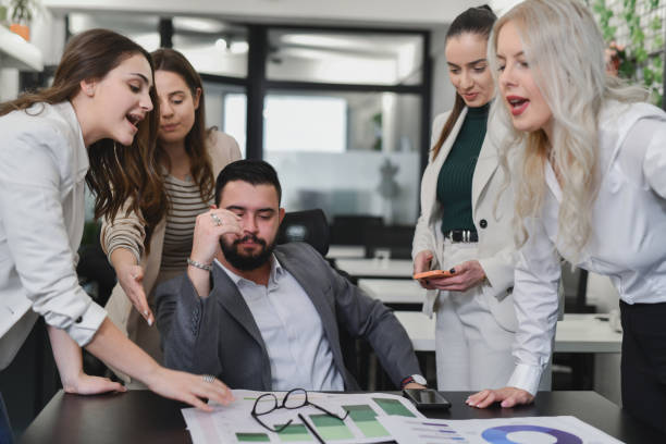 istock Male Supervisor Looking Done With Everything When Female Employees Are Screaming at Him 2195066805