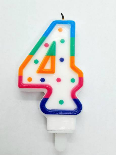 istock Number 4 birthday candle with white background 2195069265