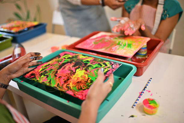 istock Cropped hands blending colors at a Creative Fluid art workshop in a Art studio 2195071195