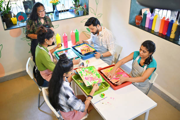 istock High angle shot of a Creative fluid art session at an art workshop with diverse participants engaged in colorful activities 2195071223