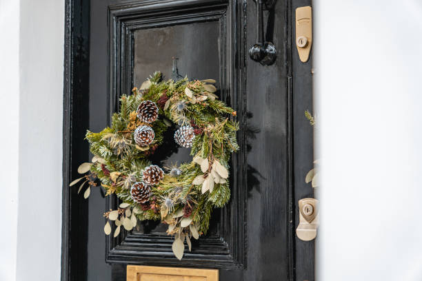 istock Pine Wreath on a Black Door 2195073620
