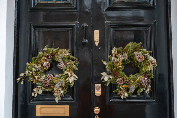 istock Pine Wreath on a Black Door 2195073636
