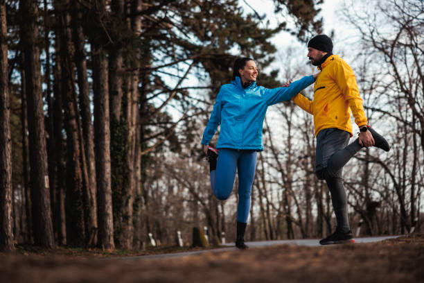 istock Couple warming up and stretching out for a morning run 2195074487