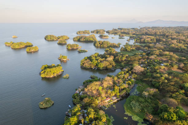 istock Green lake coast with small islands 2195075080