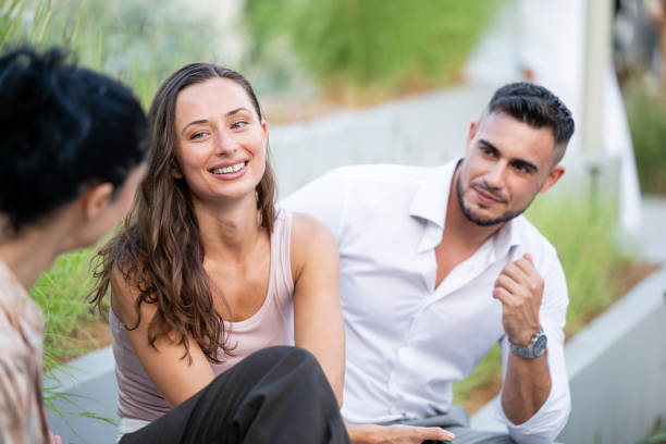 istock People chatting during break in city park 2195075933