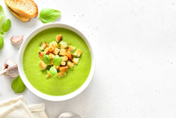 istock Spinach soup with croutons in white bowl 2195076555