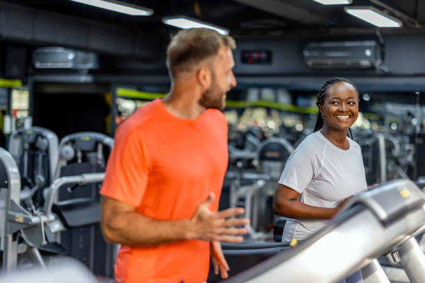 istock People Jogging Together on Treadmills in a Modern Gym Setting 2195078512