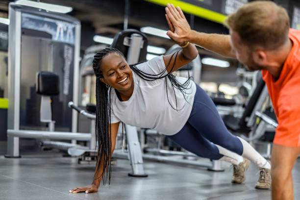 istock Two People High-Fiving During a Plank Exercise at the Gym 2195078537