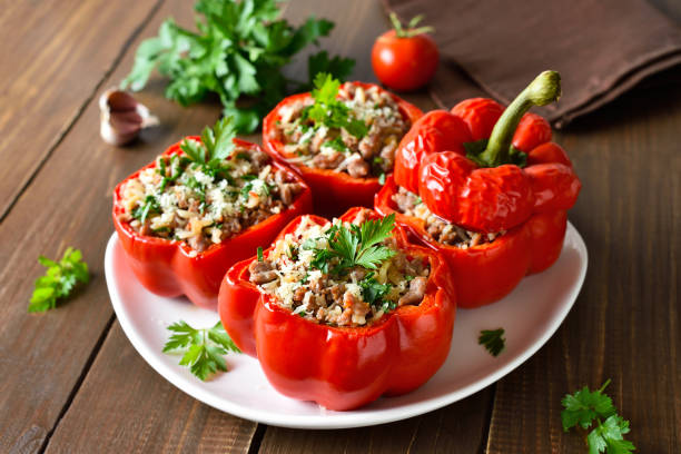 istock Stuffed red peppers with minced meat, rice, parmesan cheese 2195081219