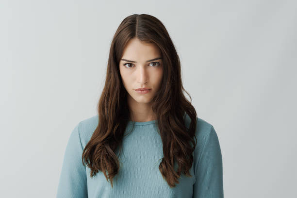 istock Confident young woman staring at camera 2195082059