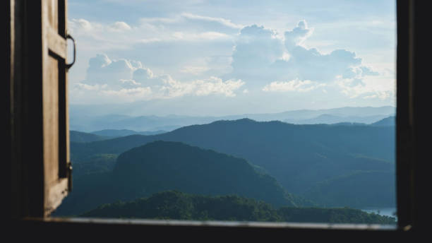 istock Landscape view of greenery mountain view and blue sky outside the window 2195082949